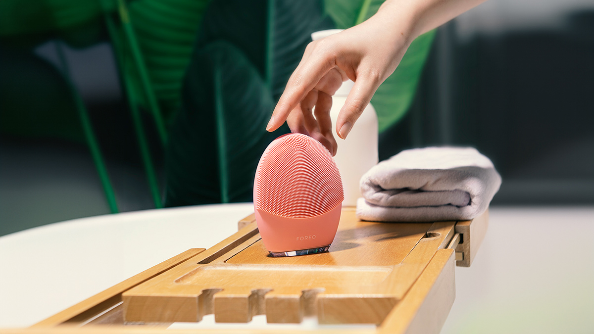 LUNA 4 facial cleansing and firming massage brush in a beautiful minimalistic bathroom  